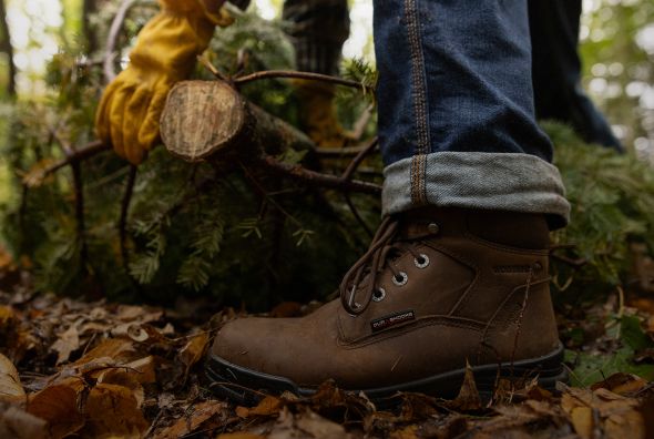 Brown boots in autumn leaves.