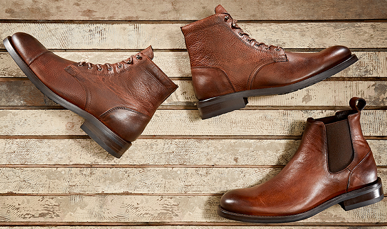 Wolverine BLVD Cap Toe in tan by a log.