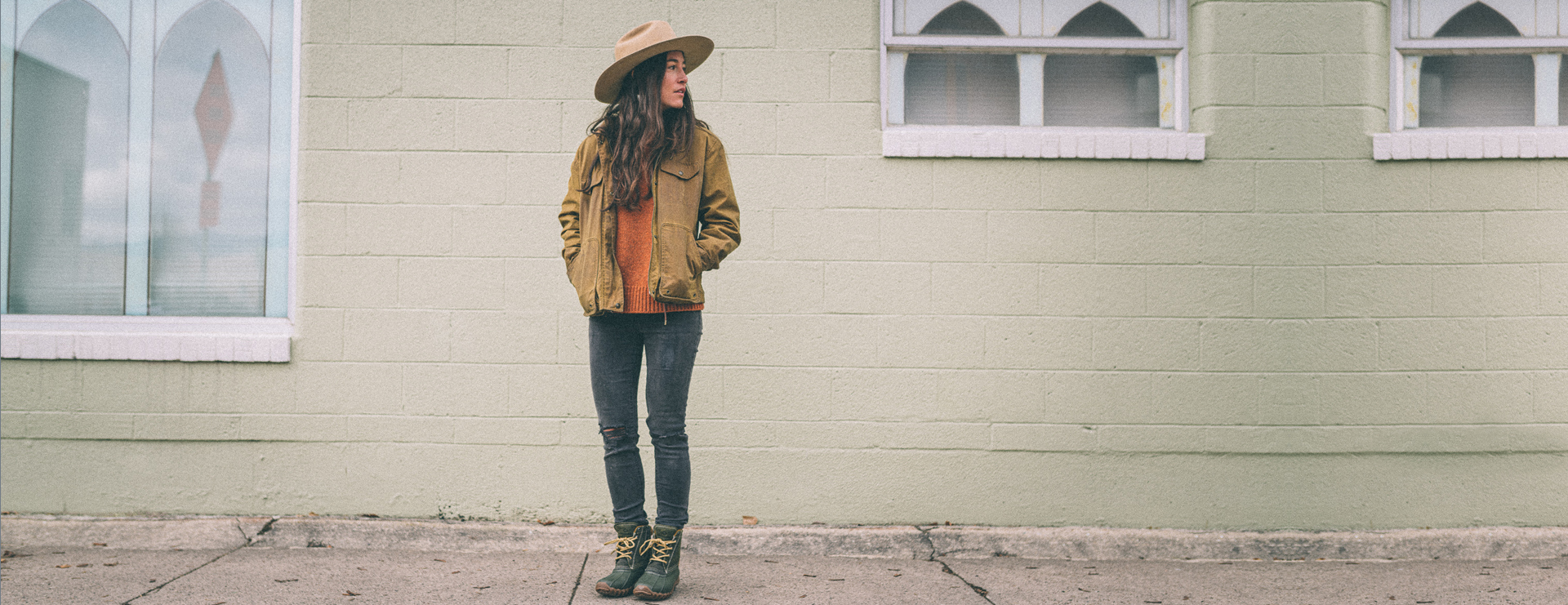 Jessie Lewis standing on the sidewalk.