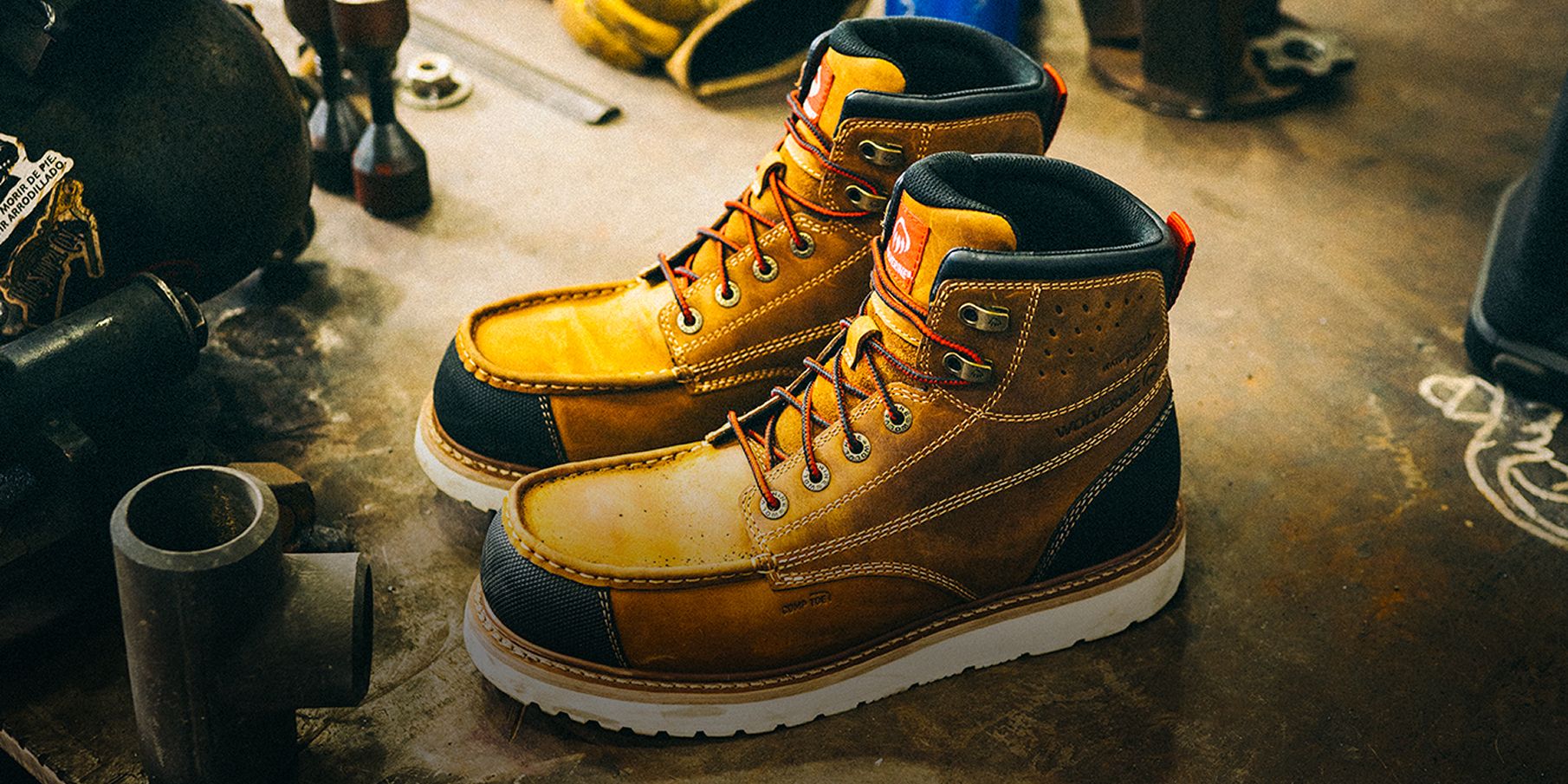 Pair of brown boots on a work site.