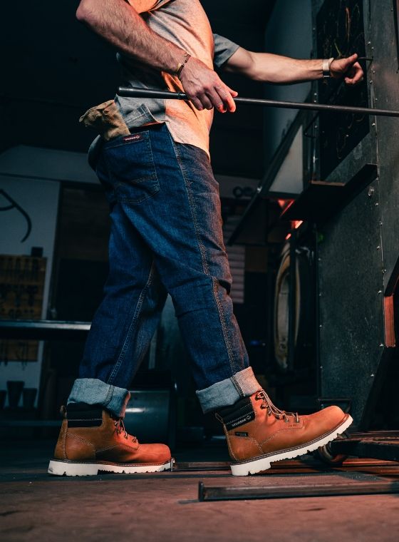 Worker wearing tan work boots