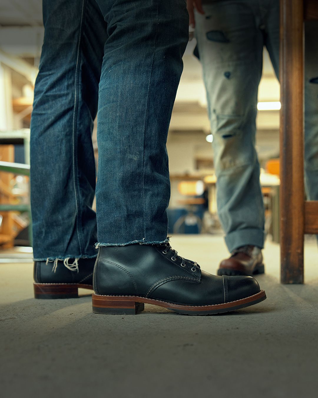 Brown boots on a stool.