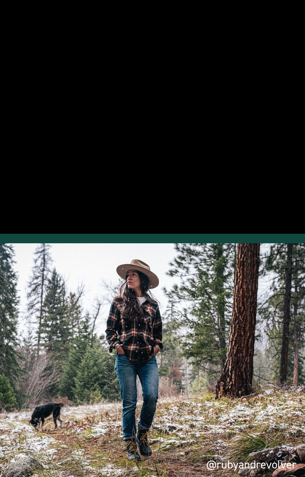 Person wearing Torrent boots out for a hike with her dog.