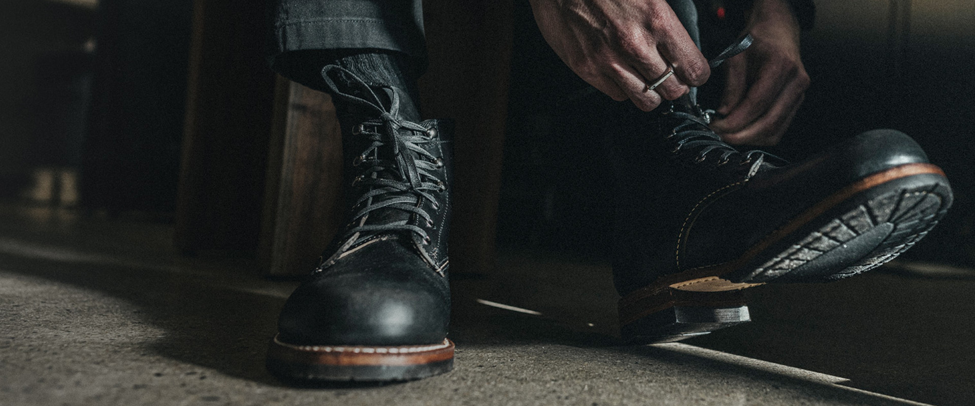 Man tying his boots.