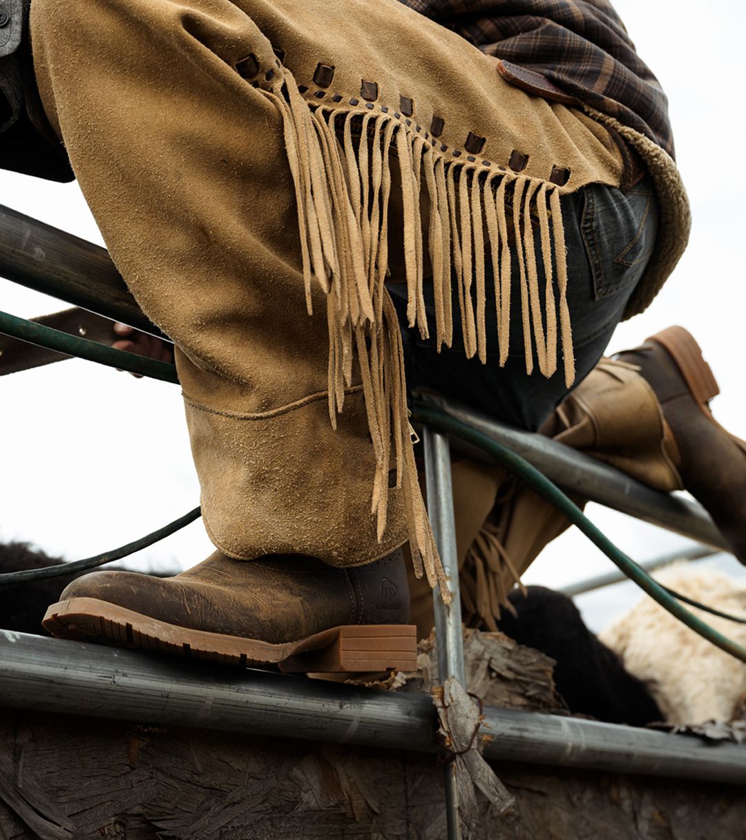 Leather tassled pants over coyote colored boots.