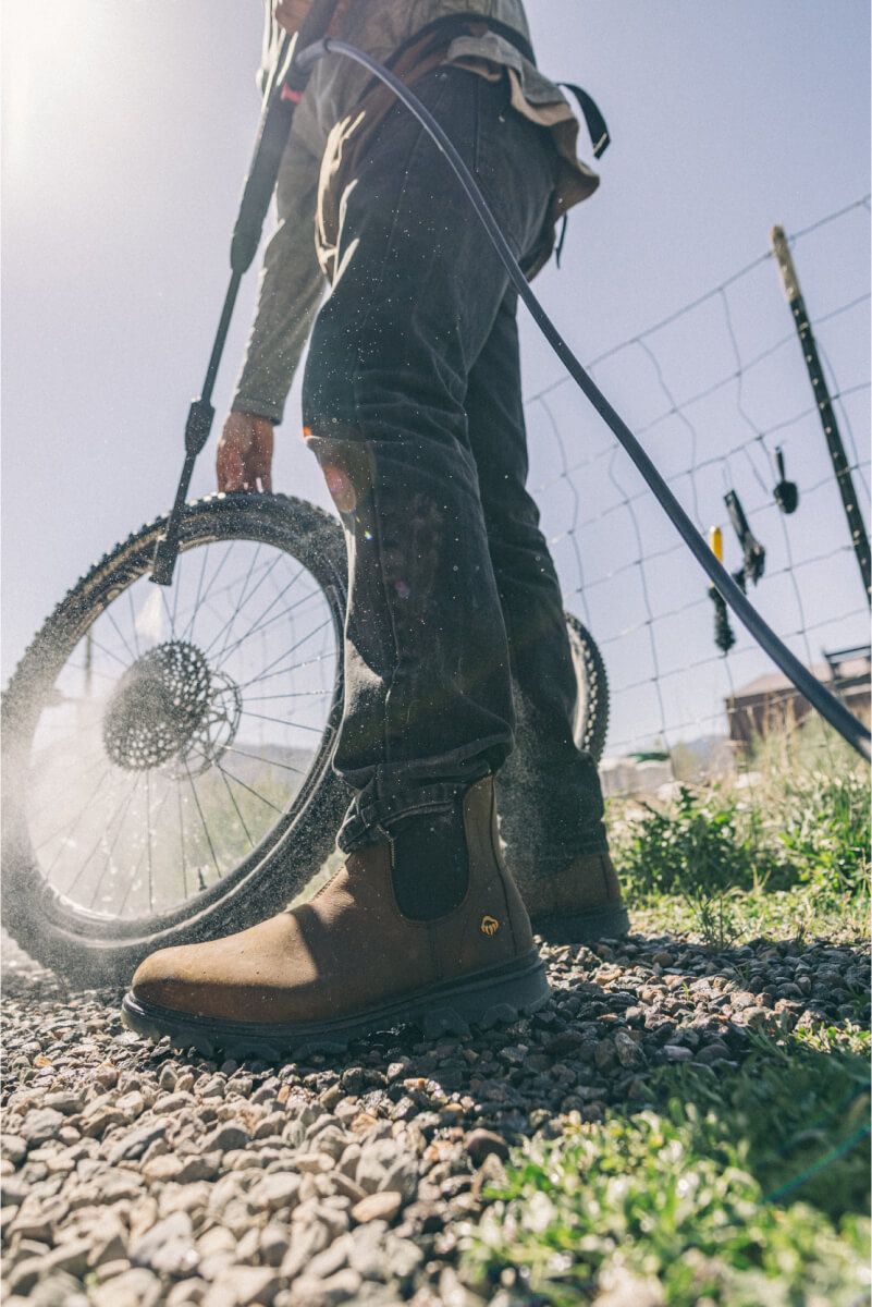 a person power washing a bicycle wheel