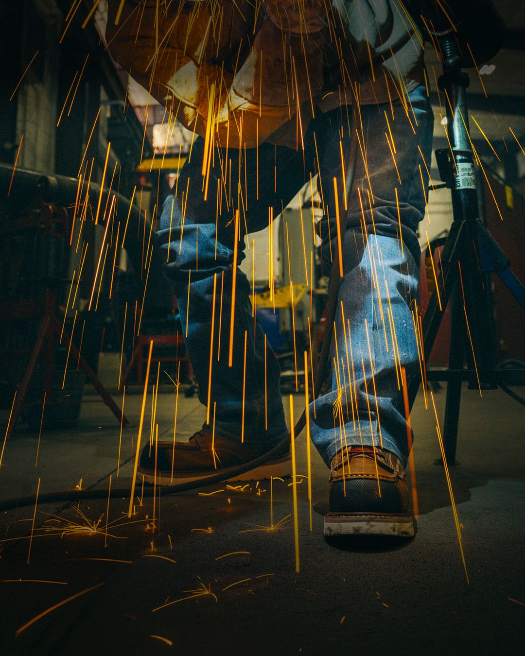Brown boots splashing through puddles.