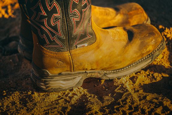 Boots in sandy soil.