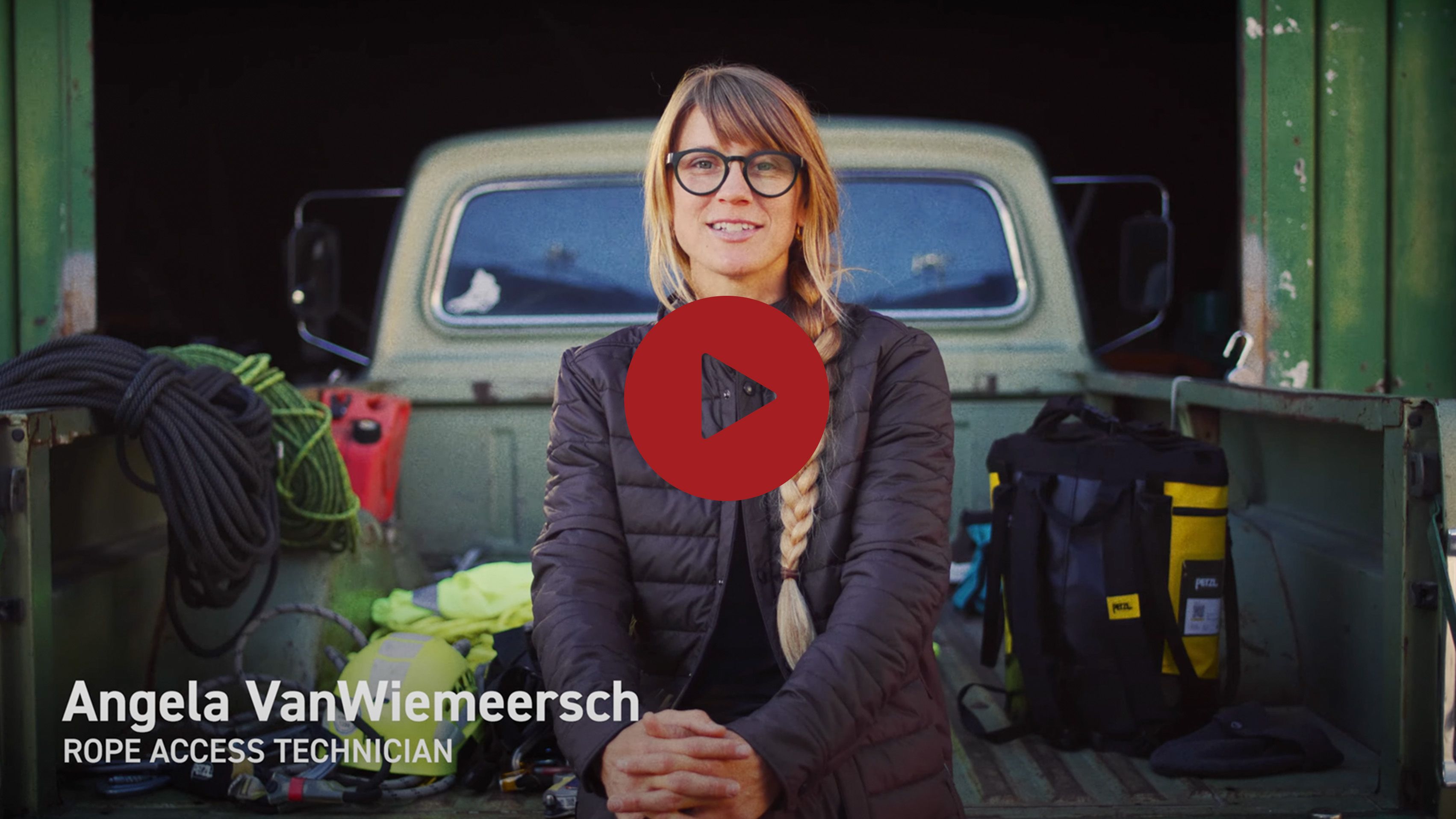 a woman sitting in the back of a truck