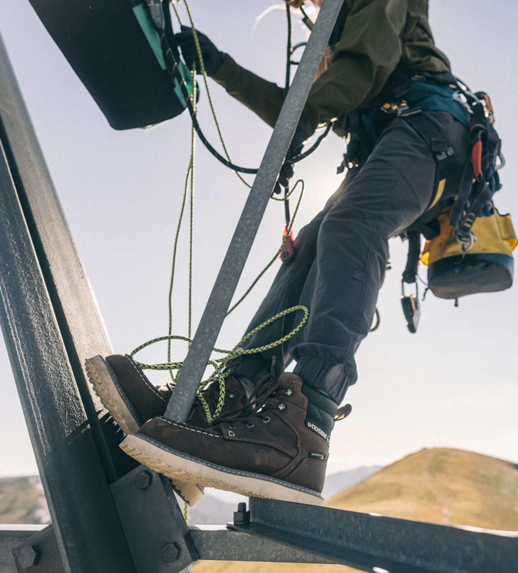 a person climbing a metal structure