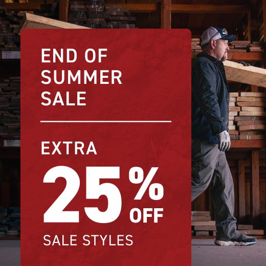 Carrying rough lumber through a woodshed.