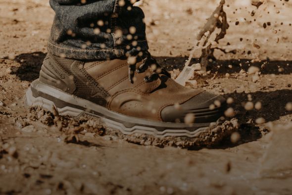 Boots stomping through mud.