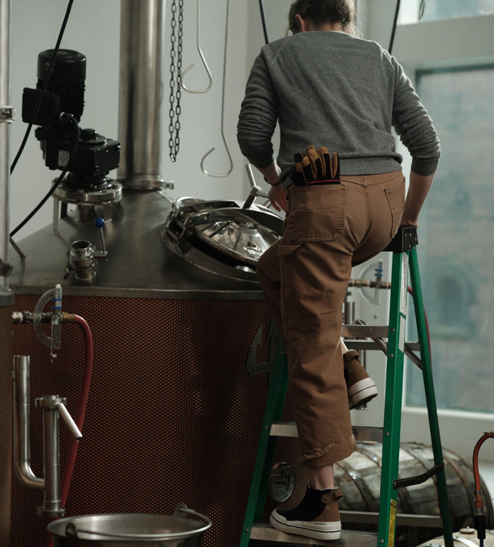 a woman standing on a ladder