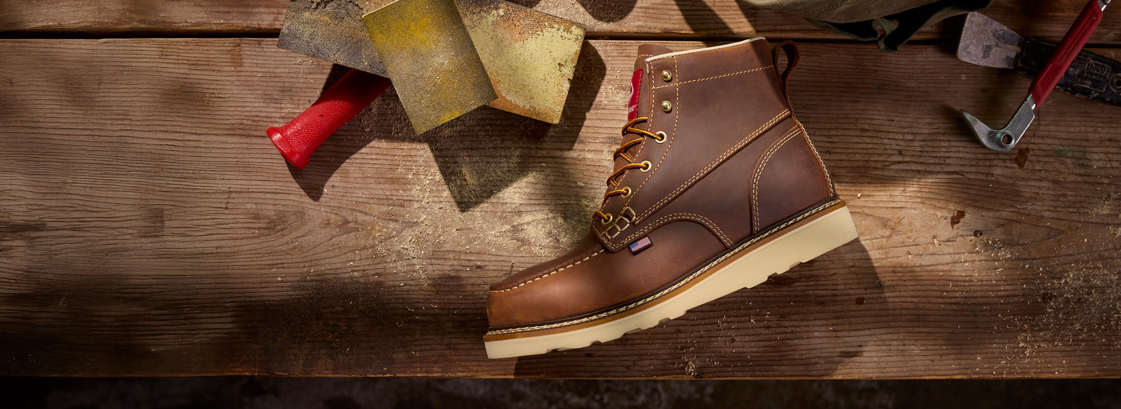 Wedge boot on a workbench surrounded by tools.