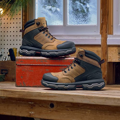 Two boots on a workbench.