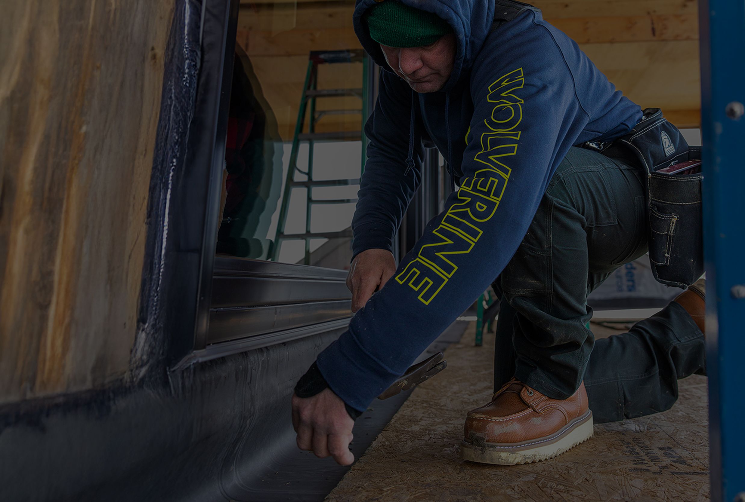 Hammering nails on a construction site.