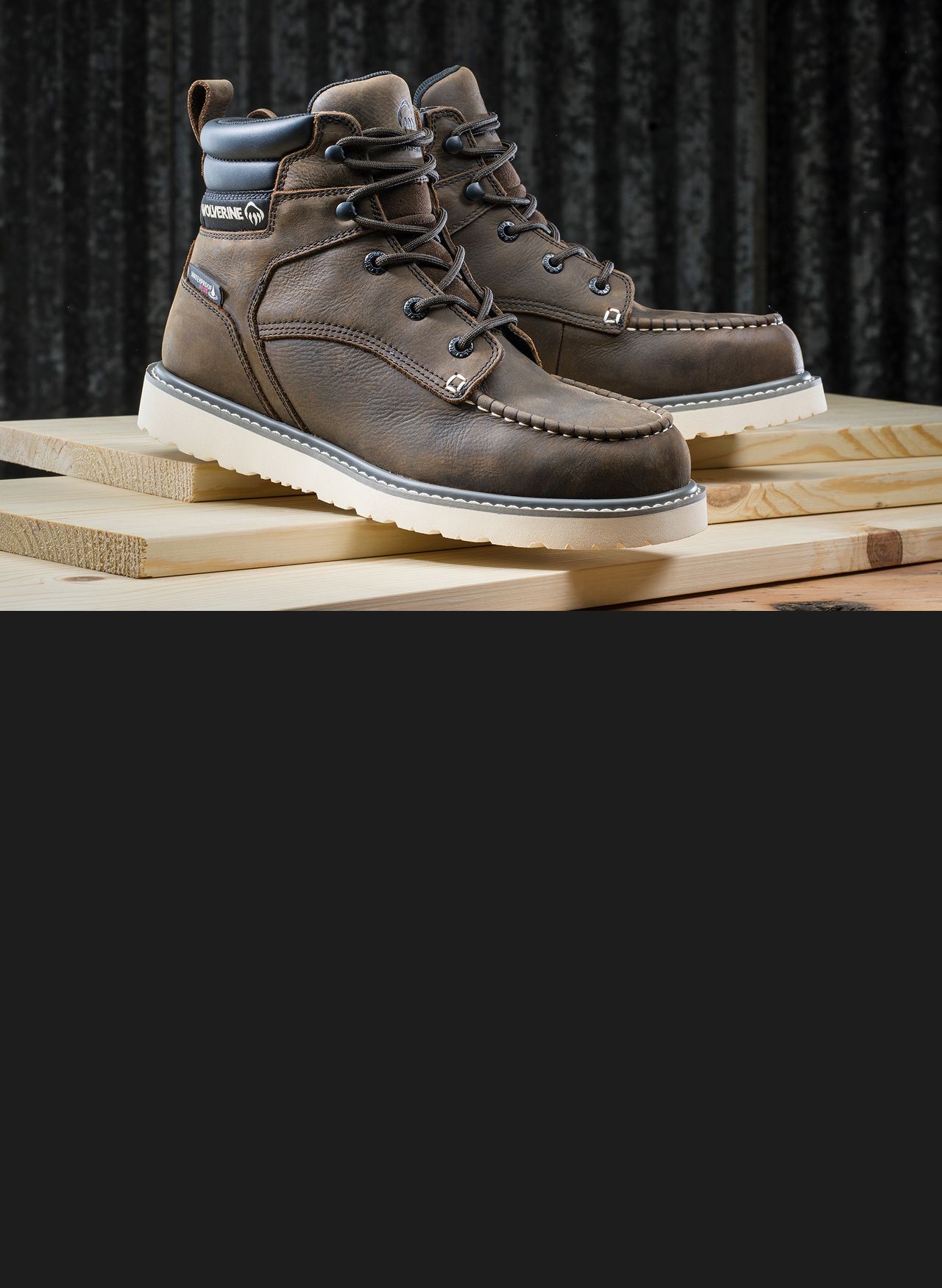 Black boot lying on concrete.