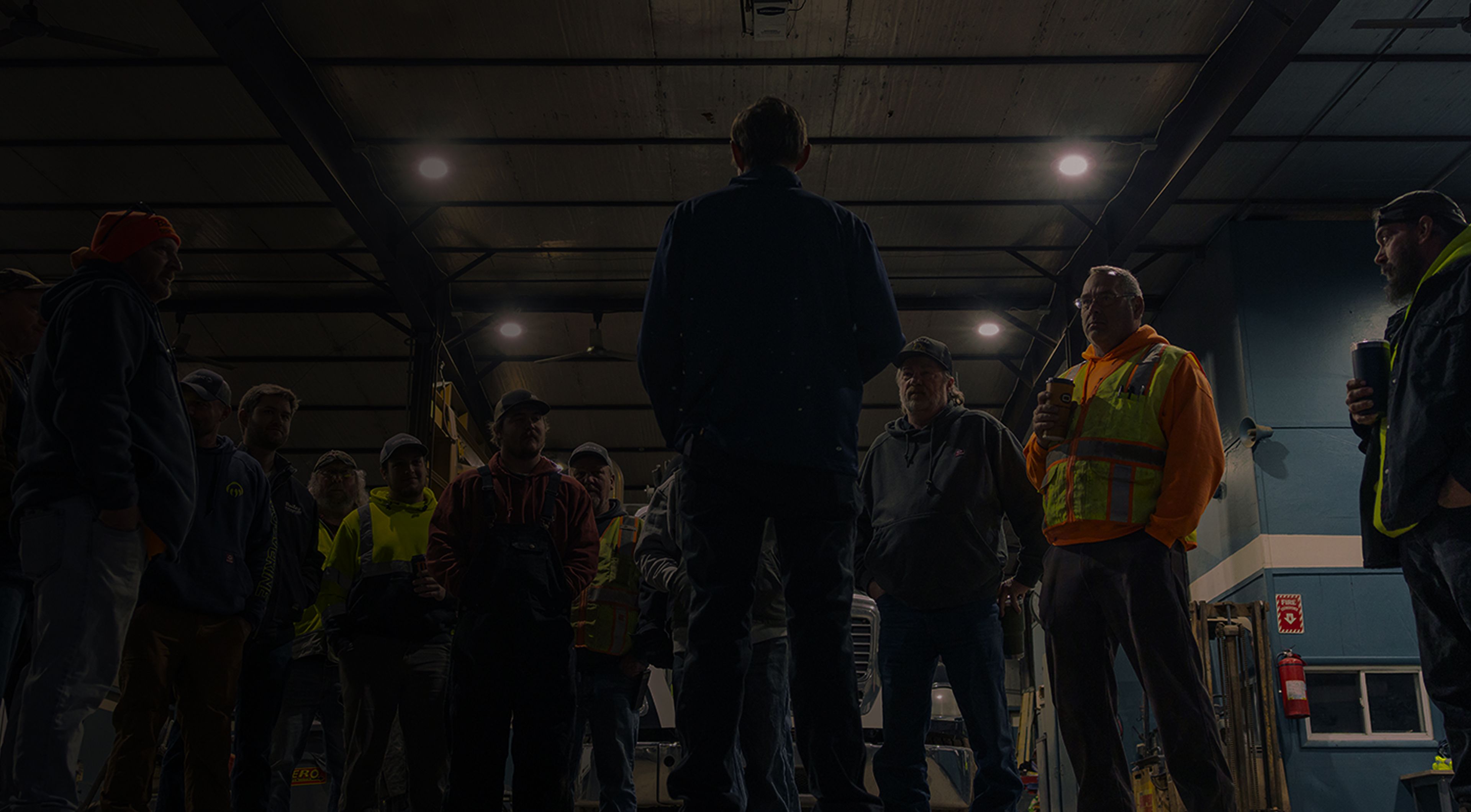 Team meeting in a warehouse.