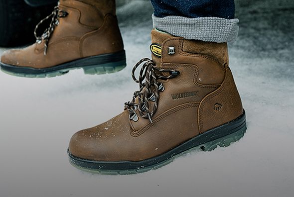 Brown boots in snow.