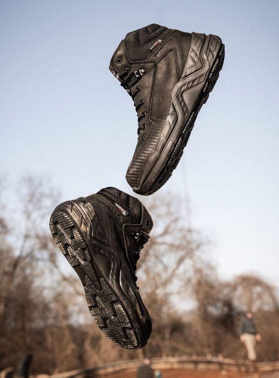 a close up of a brown and black boot