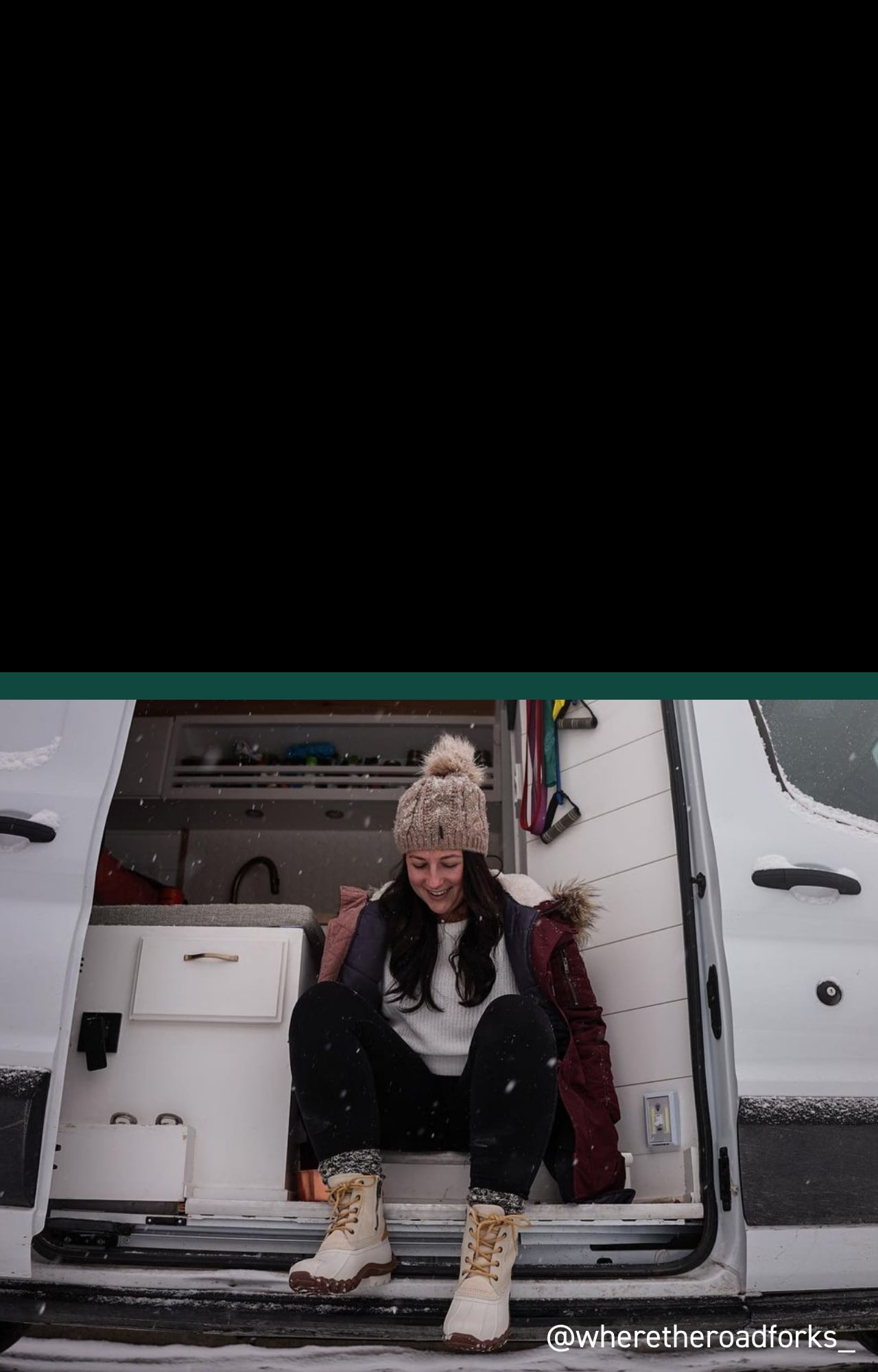 Person wearing Torrent boots sitting in a winter setting.