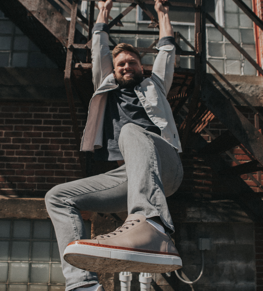 Chase hanging from a fire escape having fun.