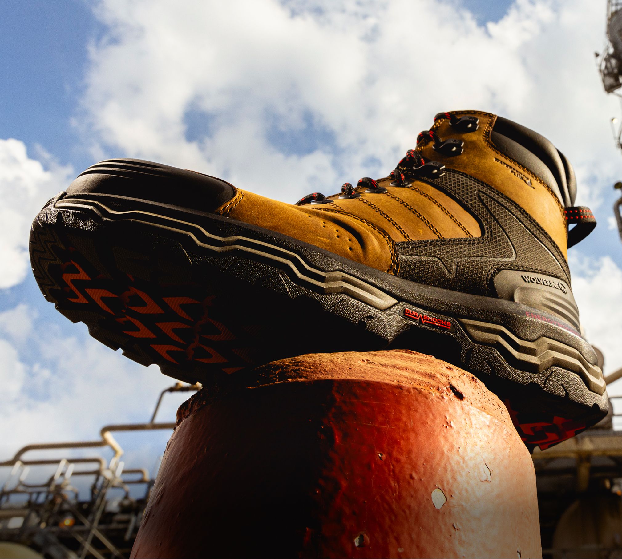 Boot on a concret pillar against the sky.
