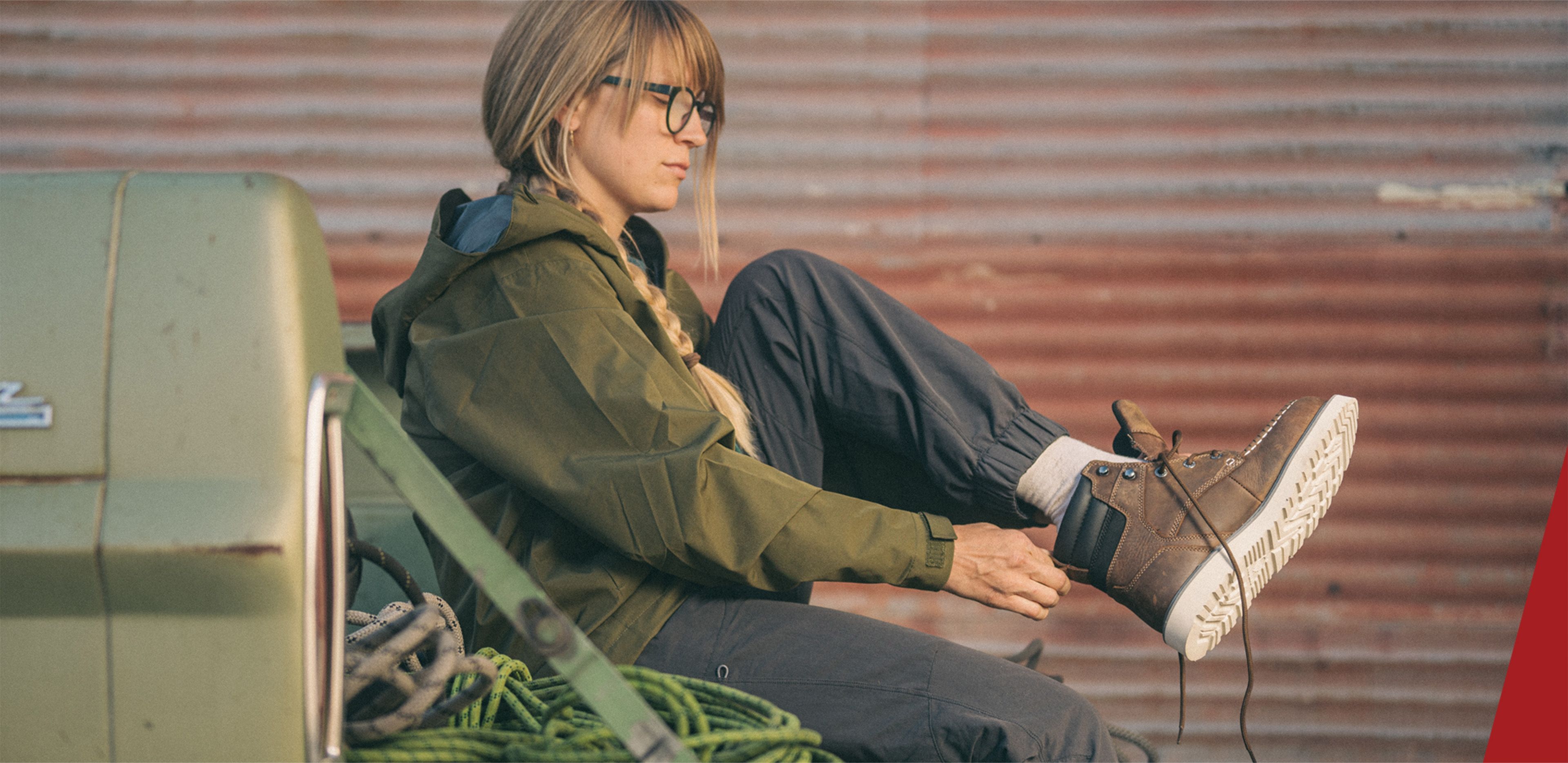 a woman sitting on the back of a truck