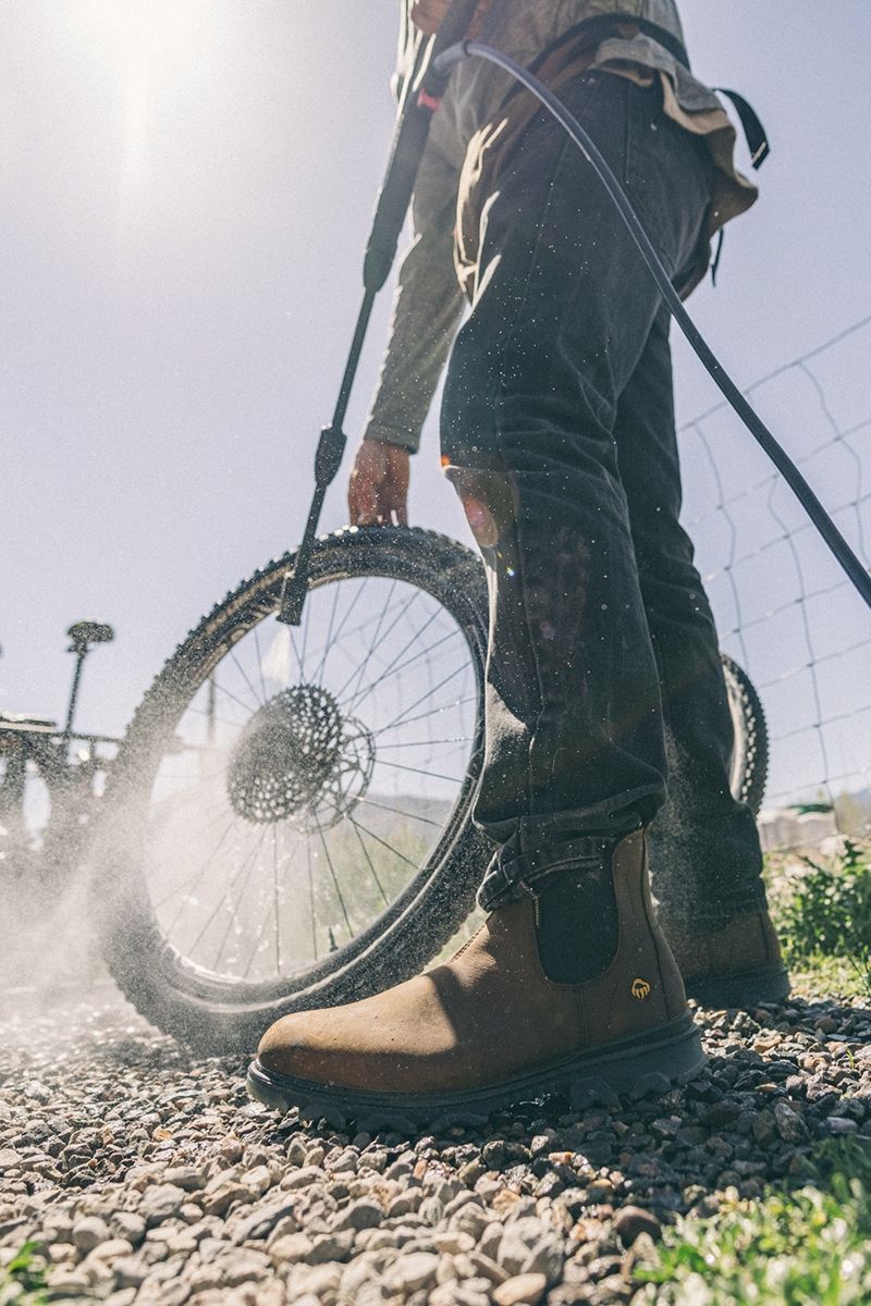 Person wearing boots power washing