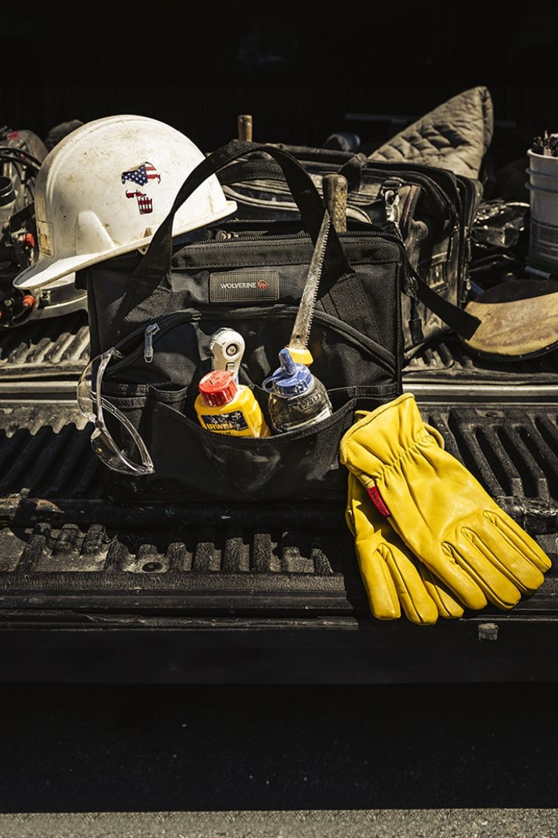 Person repairing factory machinery